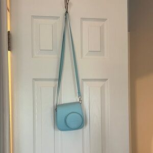 INSTAX Polaroid camera and blue case (film not included)